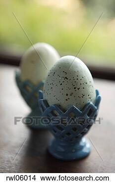 Stock Photo - hard-boiled egg 
in ceramic egg 
cup. fotosearch 
- search stock 
photos, pictures, 
images, and photo 
clipart