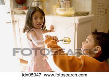 Picture - hispanic children 
fighting over 
cake batter. fotosearch 
- search stock 
photos, pictures, 
images, and photo 
clipart