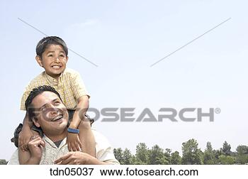 Picture - hispanic man holding 
son on shoulders. 
fotosearch - search 
stock photos, 
pictures, images, 
and photo clipart