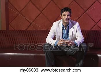 Stock Photo - hispanic man sitting 
at nightclub. 
fotosearch - search 
stock photos, 
pictures, images, 
and photo clipart