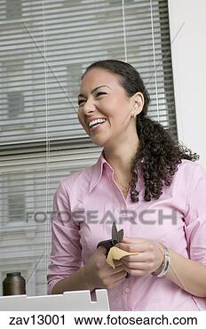 Stock Photography - hispanic woman 
cutting pieces 
of fabric. fotosearch 
- search stock 
photos, pictures, 
images, and photo 
clipart