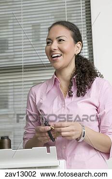 Stock Photo - hispanic woman 
cutting pieces 
of fabric. fotosearch 
- search stock 
photos, pictures, 
images, and photo 
clipart