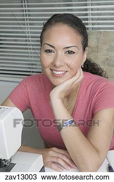 Stock Photo - hispanic woman 
using sewing machine. 
fotosearch - search 
stock photos, 
pictures, images, 
and photo clipart