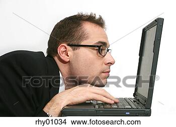 Stock Photo - hunched businessman 
using laptop. 
fotosearch - search 
stock photos, 
pictures, images, 
and photo clipart