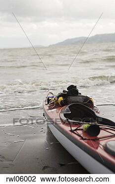 Stock Photo - kayak on beach. 
fotosearch - search 
stock photos, 
pictures, images, 
and photo clipart