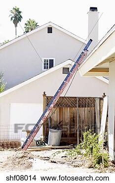 Stock Photo - ladder leaning 
on roof of house. 
fotosearch - search 
stock photos, 
pictures, images, 
and photo clipart