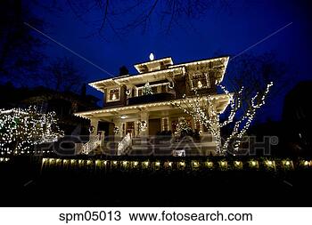 Stock Photo - lit-up decorated 
house. fotosearch 
- search stock 
photos, pictures, 
images, and photo 
clipart