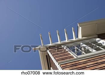 Stock Photo - low angle view 
of top corner 
of house. fotosearch 
- search stock 
photos, pictures, 
images, and photo 
clipart