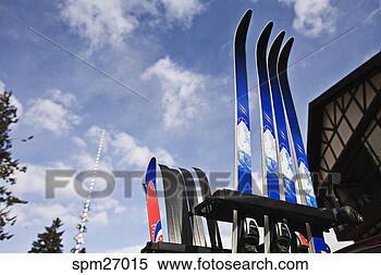 Stock Image - low angle view 
of skis in ski 
rack. fotosearch 
- search stock 
photos, pictures, 
images, and photo 
clipart
