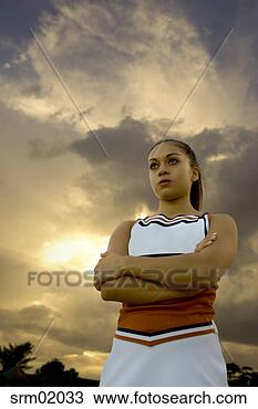 Stock Photo - low angle view 
of cheerleader 
with her arms 
crossed. fotosearch 
- search stock 
photos, pictures, 
images, and photo 
clipart