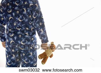Stock Photo - man in pajamas 
holding teddy 
bear. fotosearch 
- search stock 
photos, pictures, 
images, and photo 
clipart