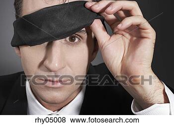 Stock Photo - man peeking out 
from under a blindfold. 
fotosearch - search 
stock photos, 
pictures, images, 
and photo clipart