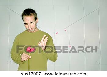 man-picking-petals_~sus17007.jpg