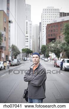Stock Photography - man standing in 
urban street. 
fotosearch - search 
stock photos, 
pictures, images, 
and photo clipart