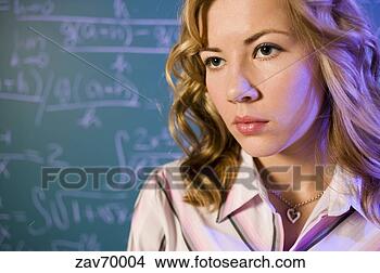 Stock Photo - math teacher and 
equation on the 
blackboard. fotosearch 
- search stock 
photos, pictures, 
images, and photo 
clipart