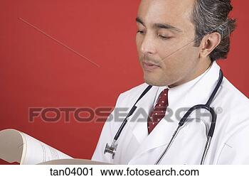 Stock Photography - middle aged hispanic 
male doctor reviewing 
papers. fotosearch 
- search stock 
photos, pictures, 
images, and photo 
clipart