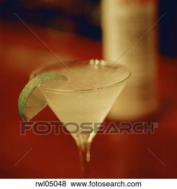 Stock Photo - mixed drink in 
martini glass 
with lime. fotosearch 
- search stock 
photos, pictures, 
images, and photo 
clipart