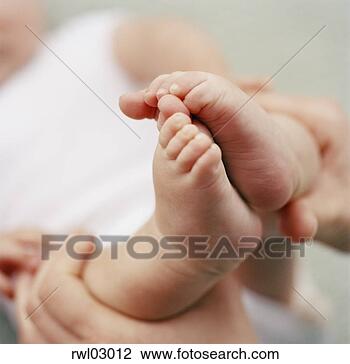 Stock Photo - mom playing with 
baby boy's feet. 
fotosearch - search 
stock photos, 
pictures, images, 
and photo clipart