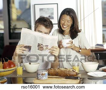 Stock Photography - multi-ethnic couple 
at breakfast. 
fotosearch - search 
stock photos, 
pictures, images, 
and photo clipart