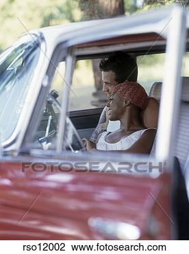 Stock Photo - multi-ethnic couple 
in car. fotosearch 
- search stock 
photos, pictures, 
images, and photo 
clipart