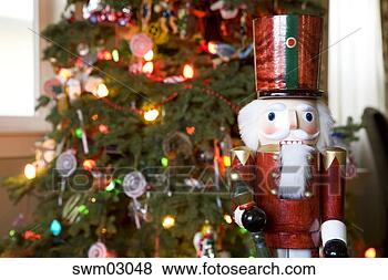 Stock Photo - nutcracker beside 
christmas tree. 
fotosearch - search 
stock photos, 
pictures, images, 
and photo clipart