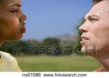 Stock Photo - opponents glaring 
at each other. 
fotosearch - search 
stock photos, 
pictures, images, 
and photo clipart