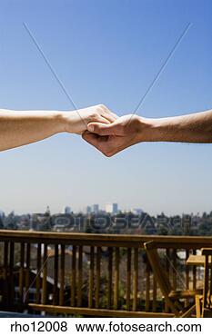 Stock Photo - people holding 
hands above cityscape. 
fotosearch - search 
stock photos, 
pictures, images, 
and photo clipart