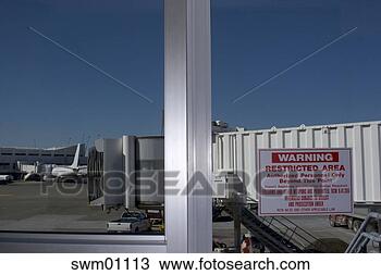 Stock Photo - restricted area 
sign on airport 
window. fotosearch 
- search stock 
photos, pictures, 
images, and photo 
clipart