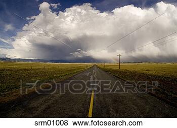 Stock Photo - scenic view of 
divided highway 
with clouds on 
the horizon. fotosearch 
- search stock 
photos, pictures, 
images, and photo 
clipart