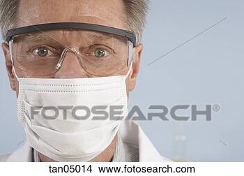 Stock Photo - scientist wearing 
surgical mask 
and safety glasses. 
fotosearch - search 
stock photos, 
pictures, images, 
and photo clipart