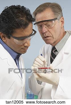 Stock Image - scientists looking 
at petri dish. 
fotosearch - search 
stock photos, 
pictures, images, 
and photo clipart