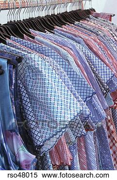 Stock Image - shirts hanging 
on rack. fotosearch 
- search stock 
photos, pictures, 
images, and photo 
clipart