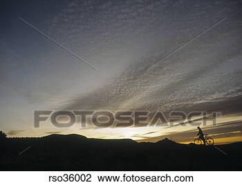 Stock Photo - silhouette of 
cyclist on hill. 
fotosearch - search 
stock photos, 
pictures, images, 
and photo clipart