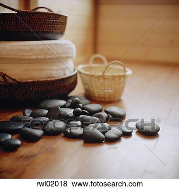Stock Photo - smooth massage 
stones on the 
floor. fotosearch 
- search stock 
photos, pictures, 
images, and photo 
clipart