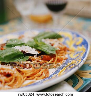 Stock Photo - spaghetti with 
basil and parmesan 
cheese on serving 
plate. fotosearch 
- search stock 
photos, pictures, 
images, and photo 
clipart
