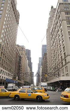Stock Photography - taxis driving 
in new york city, 
new york. fotosearch 
- search stock 
photos, pictures, 
images, and photo 
clipart