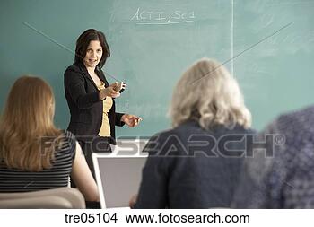 Stock Photo - teacher pointing 
eraser at class. 
fotosearch - search 
stock photos, 
pictures, images, 
and photo clipart