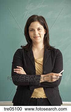Stock Photography - teacher standing 
in front of chalkboard. 
fotosearch - search 
stock photos, 
pictures, images, 
and photo clipart
