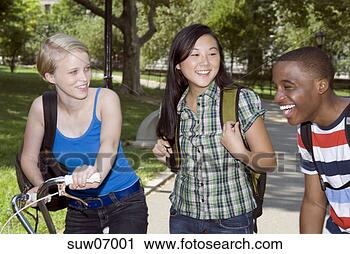 Stock Photography - three teenagers 
laughing outdoors. 
fotosearch - search 
stock photos, 
pictures, images, 
and photo clipart