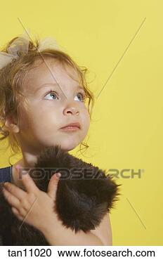 Stock Photography - toddler girl holding 
stuffed animal. 
fotosearch - search 
stock photos, 
pictures, images, 
and photo clipart
