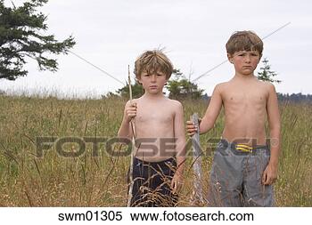 Stock Image - two young boys 
standing in field. 
fotosearch - search 
stock photos, 
pictures, images, 
and photo clipart