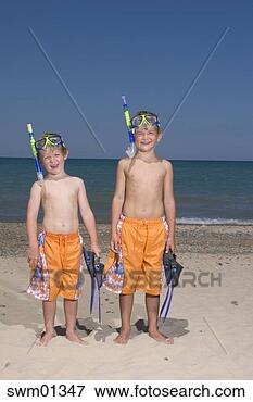 Picture - two young boys 
standing in snorkeling 
masks. fotosearch 
- search stock 
photos, pictures, 
images, and photo 
clipart
