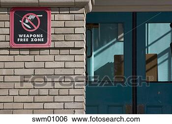 Stock Photo - weapons free zone 
sign on brick 
building. fotosearch 
- search stock 
photos, pictures, 
images, and photo 
clipart