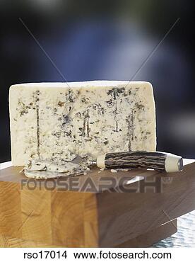 Stock Photo - wedge of blue 
cheese on a wooden 
block. fotosearch 
- search stock 
photos, pictures, 
images, and photo 
clipart