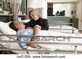 Stock Photo - wife consoling 
husband in hospital. 
fotosearch - search 
stock photos, 
pictures, images, 
and photo clipart
