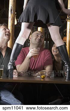 Stock Photography - woman dancing 
on table while 
friends watch. 
fotosearch - search 
stock photos, 
pictures, images, 
and photo clipart