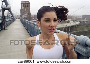 Stock Photography - woman running 
on bridge. fotosearch 
- search stock 
photos, pictures, 
images, and photo 
clipart
