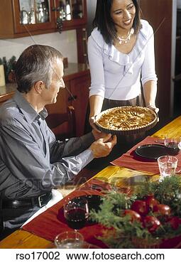 Stock Photo - woman serving 
tart. fotosearch 
- search stock 
photos, pictures, 
images, and photo 
clipart