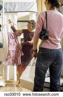 Stock Photography - woman shopping 
for skirt. fotosearch 
- search stock 
photos, pictures, 
images, and photo 
clipart