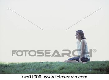 Stock Photo - woman sitting 
on green lawn. 
fotosearch - search 
stock photos, 
pictures, images, 
and photo clipart